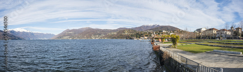 The beautiful Parco a Lago in Luino with the snow-capped mountains in the background