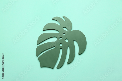 Decorative palm leaf on blu...