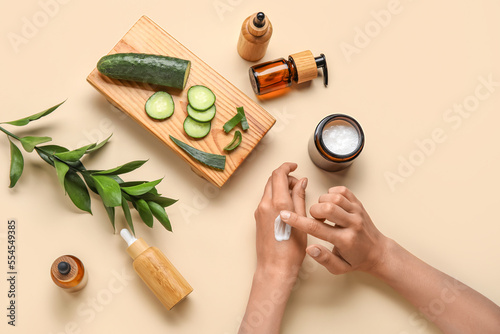 Woman applying essential oi...