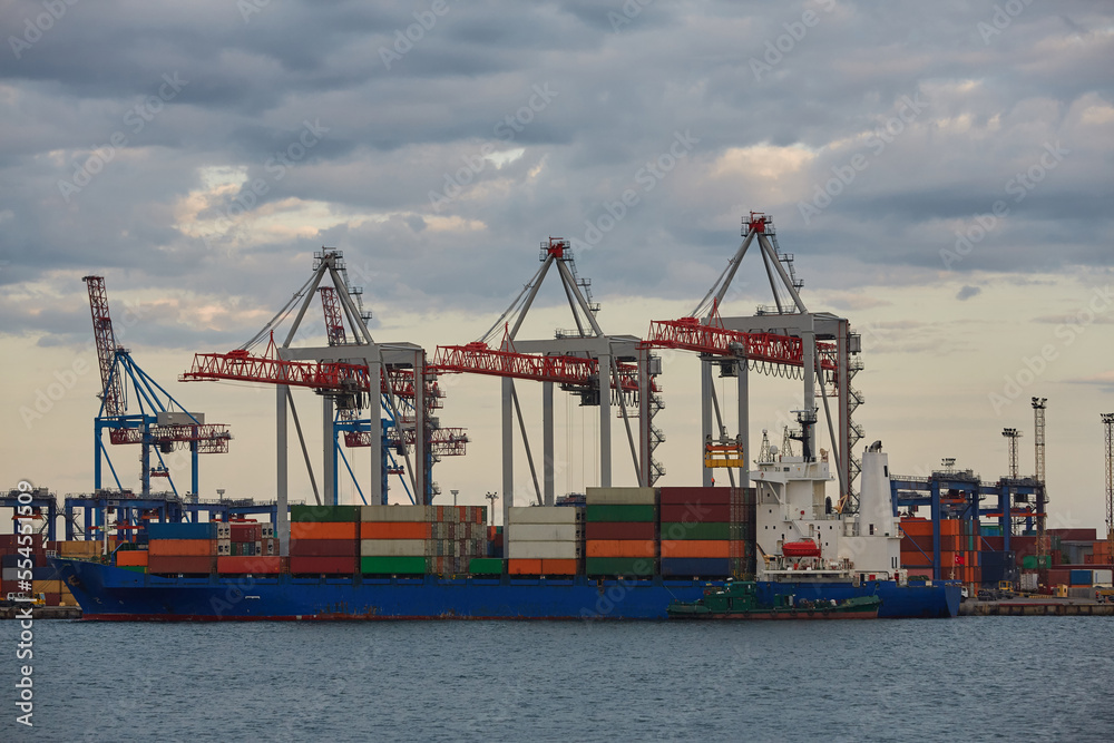 Container ship in port at container terminal. Ships of container ships stand in terminal of port on loading, unloading container. Container ship in port at container terminal. Ships of container ships stand in terminal of port on loading, unloading container.