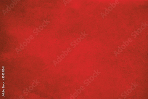 The background is red suede. The texture of suede leather dyed red.