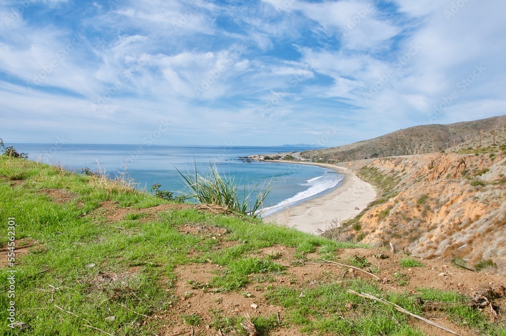 View of Leo Carillo state beach from distance blue sky clouds Malibu California