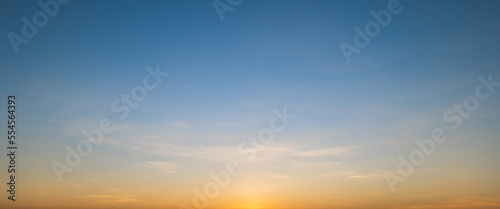 Morning sky scene with a bright golden light. Beautiful sunrise with clouds soft. Nature background concept