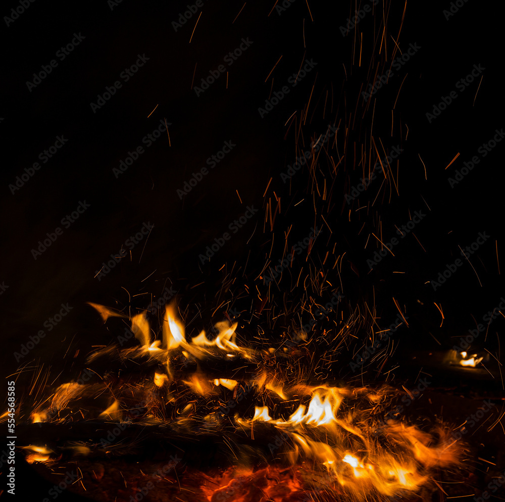 Photo of hot sparking live-coals burning, spark of bonfire. Photo of hot sparking live-coals burning, spark of bonfire.