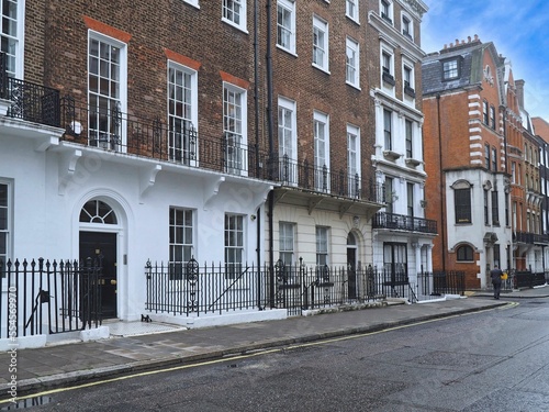 Fototapeta Naklejka Na Ścianę i Meble -  Residential street in Marylebone, London, England, with small old apartment buildings or townhouses