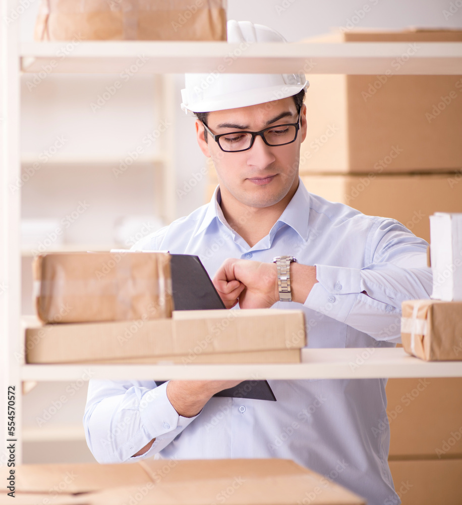 Man working in postal parcel delivery service office Man working in postal parcel delivery service office
