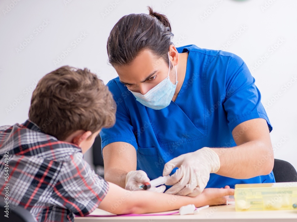Young boy visiting doctor in hospital Young boy visiting doctor in hospital