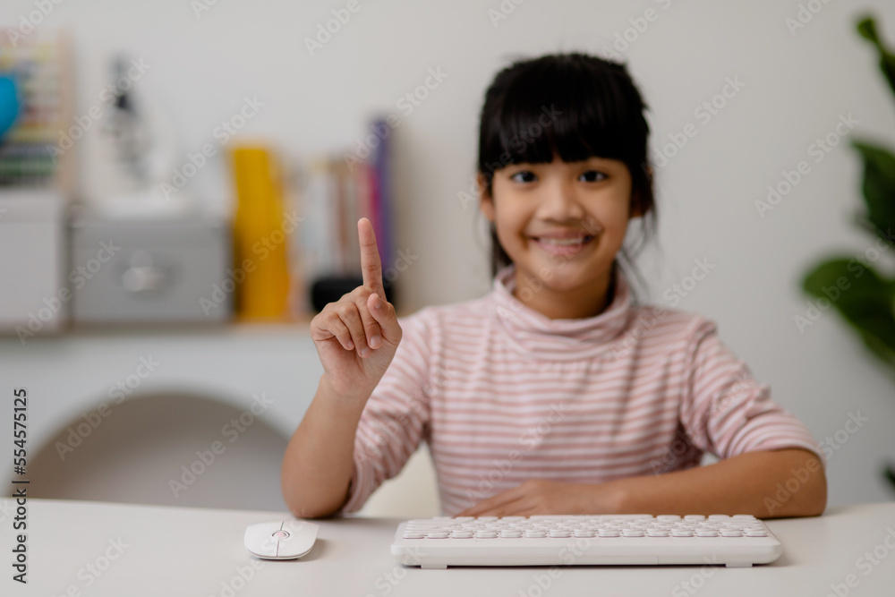 education, school, and imaginary screen concept - Asian little girl pointing in the air or imaginary screen education, school, and imaginary screen concept - Asian little girl pointing in the air or imaginary screen