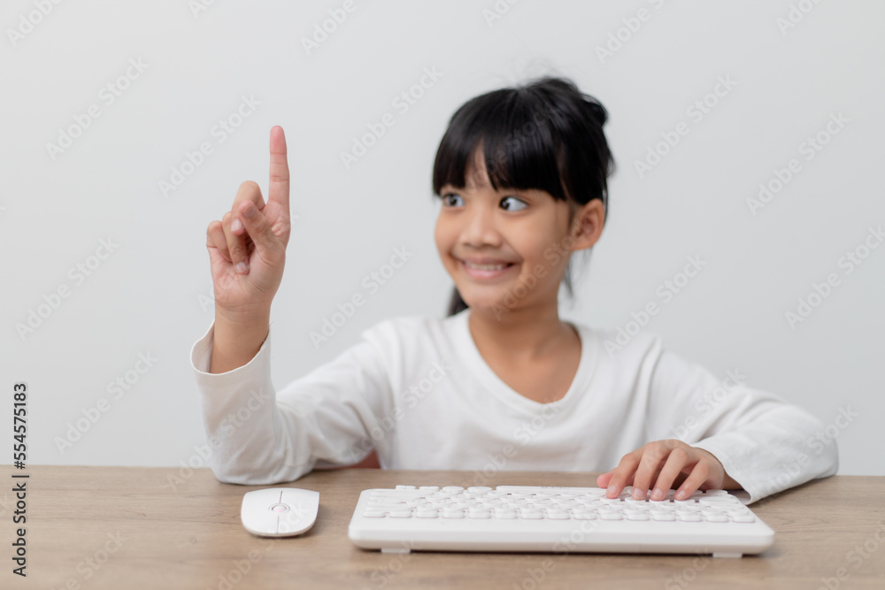 education, school, and imaginary screen concept - Asian little girl pointing in the air or imaginary screen education, school, and imaginary screen concept - Asian little girl pointing in the air or imaginary screen