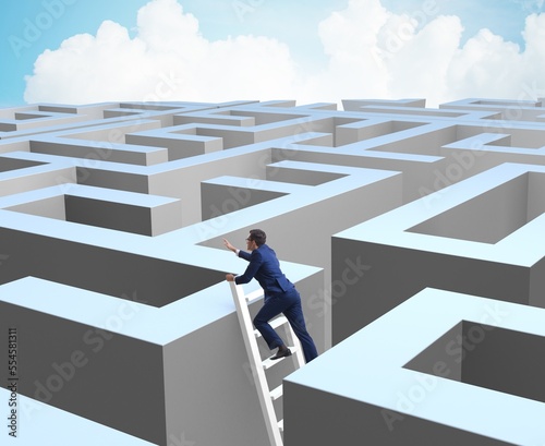 Businessman trying to escape from maze