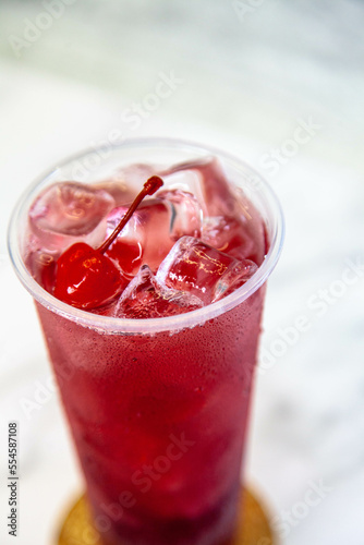 Wallpaper Mural Lemonade with ice and red cherries in a large plastic glass Torontodigital.ca