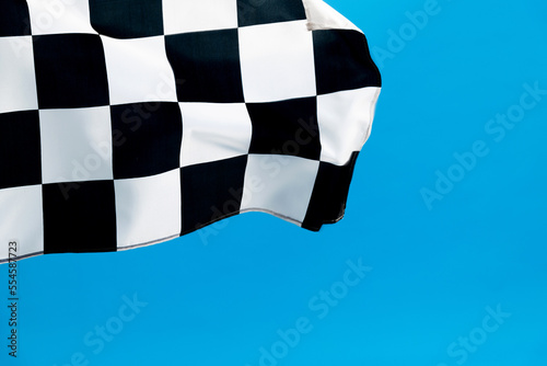 Checkered flag waving on blue background