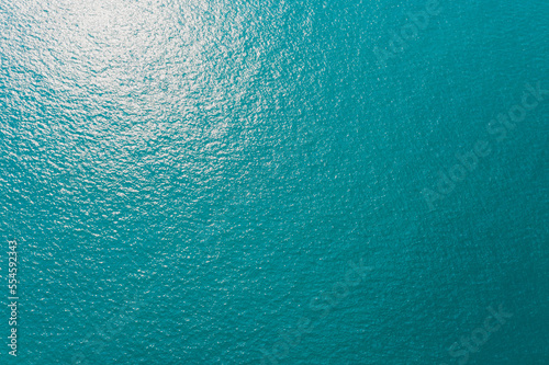 Top view of beautiful turquoise sea water surface texture background