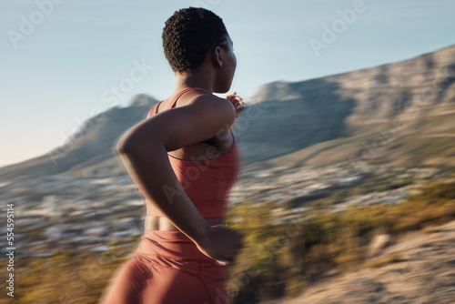 Obraz na plátne Exercise, fitness and back of black woman running in nature for heart health and wellness