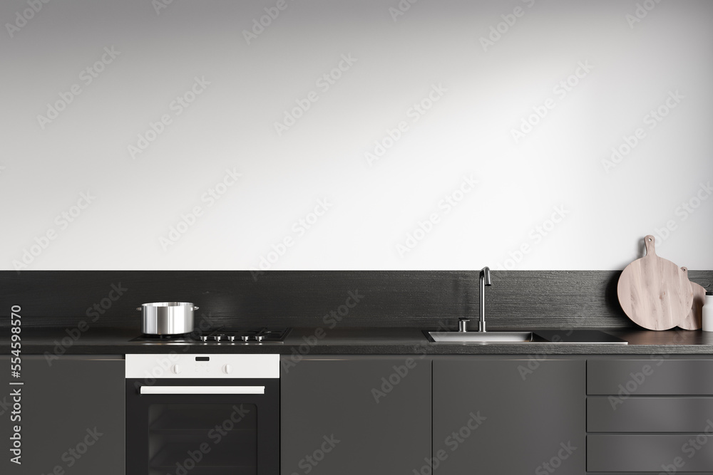 Front view on dark kitchen room interior with white wall Front view on dark kitchen room interior with white wall