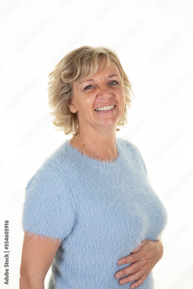 blond senior woman portrait in sweater wool blue on white background blond senior woman portrait in sweater wool blue on white background