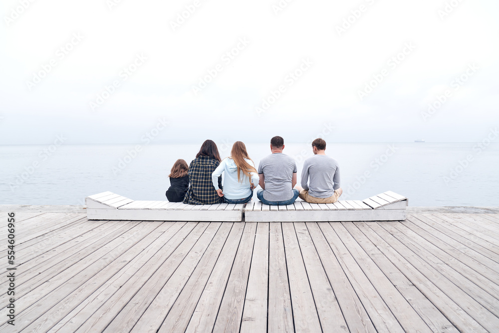 Group of people sitting on a bench