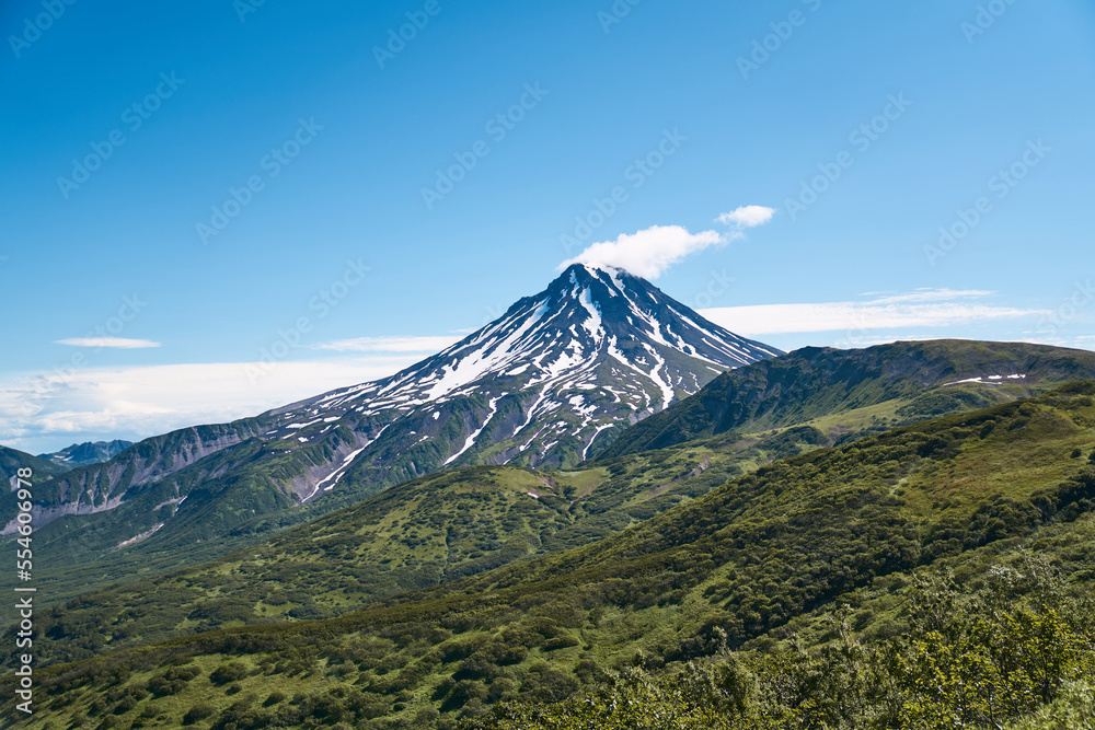 Summer landscape. Vilyuchinsky volcano against blue sky. Kamchatka peninsula Summer landscape. Vilyuchinsky volcano against blue sky. Kamchatka peninsula