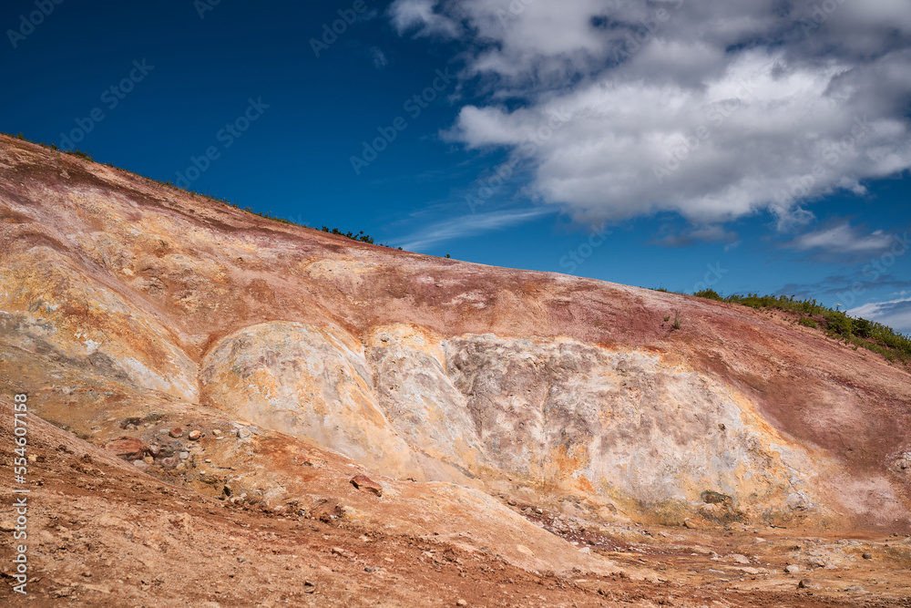 Red hills in the geothermal area of Kamchatka. Summer landscape