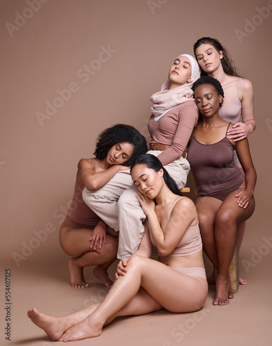 Diversity, woman and body positive skincare beauty for inclusion, spa dermatology wellness and natural body care in studio. Interracial model friends, support and relax cosmetic equality in underwear