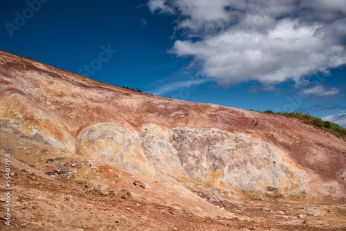 Red hills in the geothermal area of Kamchatka. Summer landscape