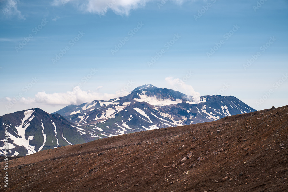 Hiking trail through alpine area. Beautiful landscape in the summer time. Kamchatka peninsula