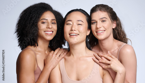 Beauty, women and diversity for skincare, cosmetics and makeup advertising while together with a smile and happiness for freedom, self love and glow. Face of female group with different skin color