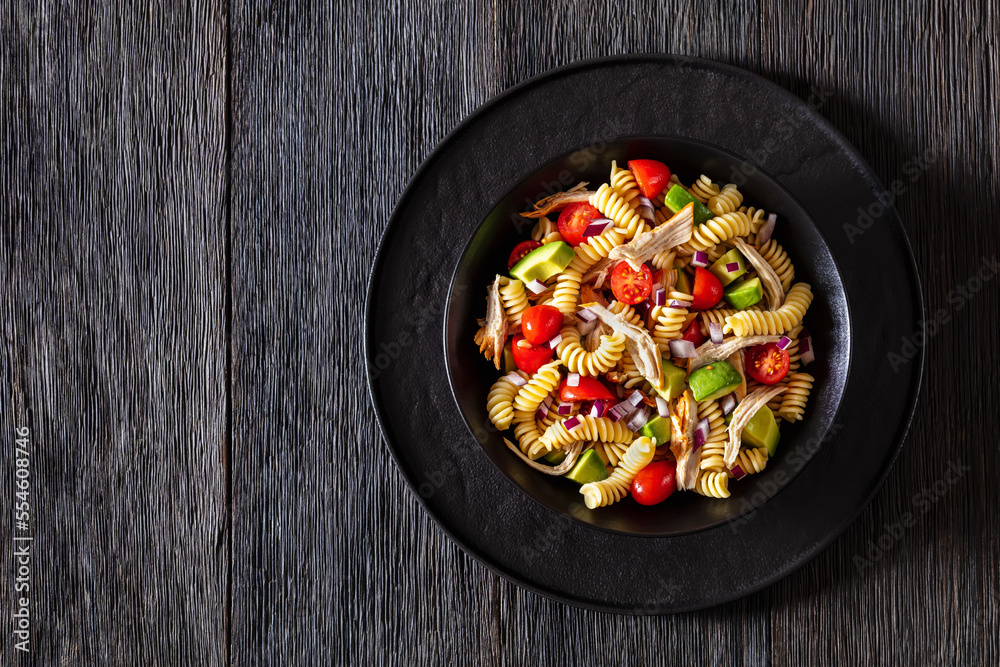 Chicken Pasta Salad with Avocado, Tomato in bowl Chicken Pasta Salad with Avocado, Tomato in bowl