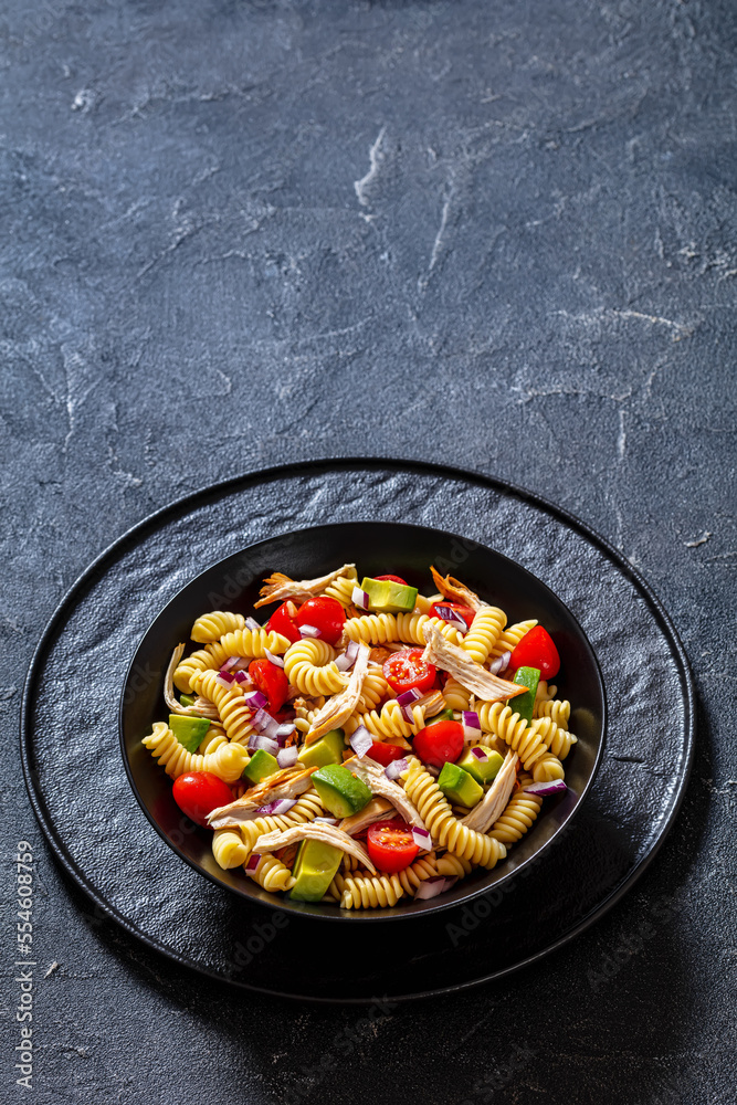 Chicken Pasta Salad with Avocado, Tomato in bowl Chicken Pasta Salad with Avocado, Tomato in bowl