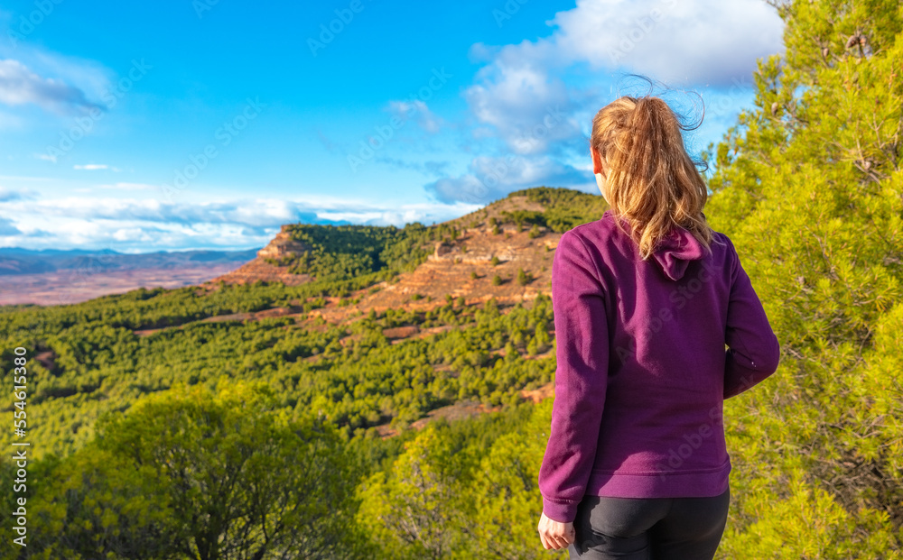 hiker woman looking at panoramic landscape view in Spain hiker woman looking at panoramic landscape view in Spain