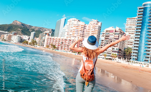 Woman tourist enjoying Calpe city and tropical beach, Alicanta, Spain photo