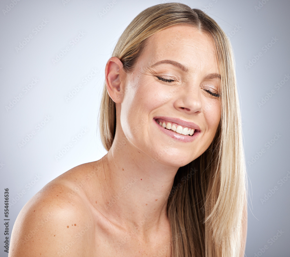 Beauty, hair care and happy woman in a studio with healthy, shiny and long hair from a treatment. Happiness, smile and female model with a clean, cosmetic and natural hair style by a gray background. Beauty, hair care and happy woman in a studio with healthy, shiny and long hair from a treatment. Happiness, smile and female model with a clean, cosmetic and natural hair style by a gray background.