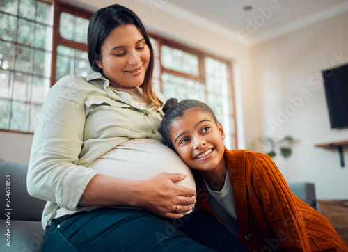 Love, home and pregnant mother with child listening to movement of baby in belly with happy smile. Family home, pregnancy and mom relaxing with excited, young and curious daughter on sofa.