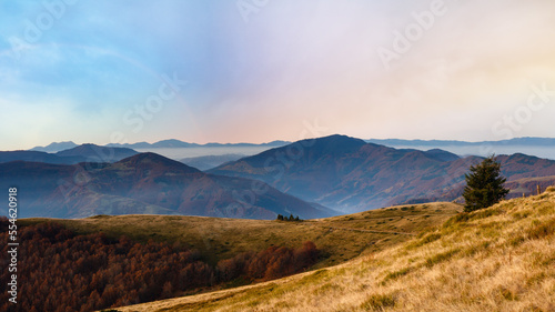 Autumn morning Carpathian mountain hazy landscape. Panorama.