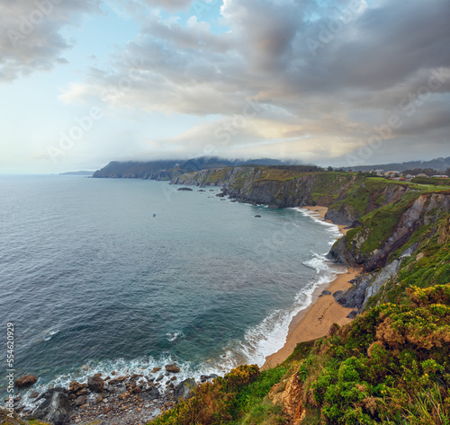 Evening Costa de Loiba landscape with sandy beach (Asturias, Spain). photo