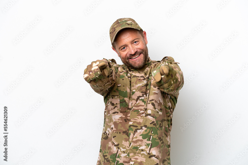 Military man isolated on white background points finger at you while smiling Military man isolated on white background points finger at you while smiling
