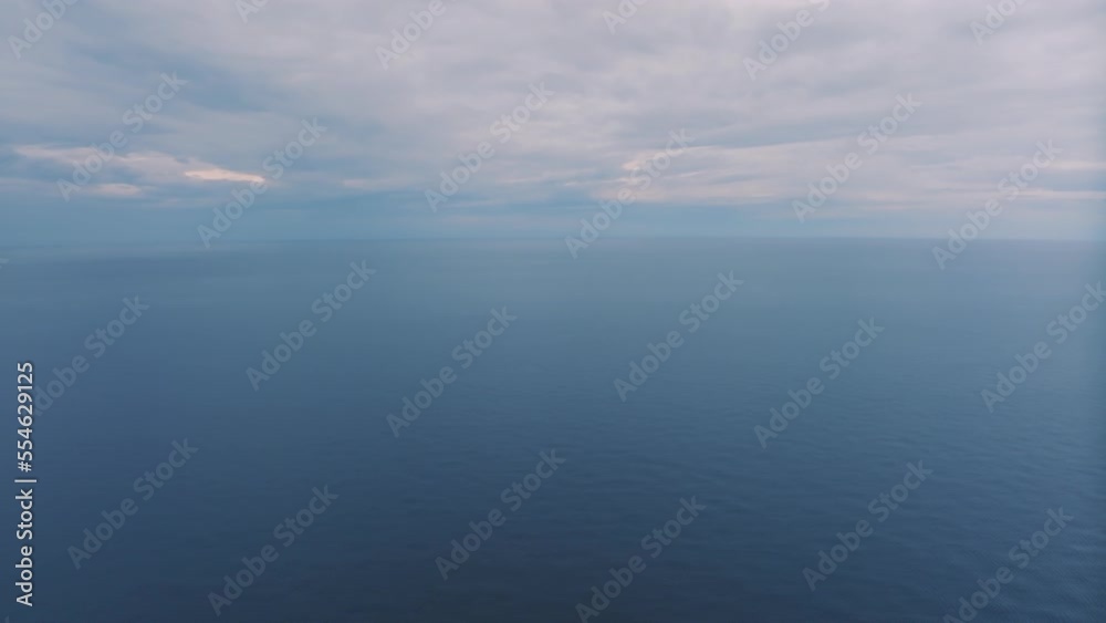 custom made wallpaper toronto digitalAerial drone video footage flight over the blue sea at sunset. Beautiful clouds. Mountains in the background. Seascape.