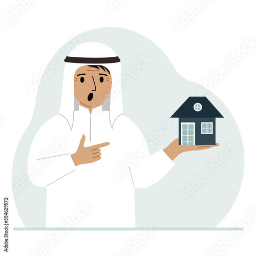 A man holds a small house in his palm. Concepts of inheritance, real estate transfer, mortgage, credit, loan or house purchase.