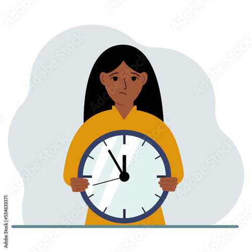 The woman is holding a big clock in his hands. Time management, planning, organization of working time, effective business, deadline.