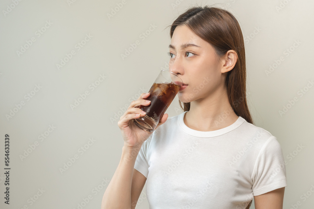 Thirsty, attractive asian young woman, girl drink or sip, holding a glass of cold sparkling water with ice in hand, refreshness people, isolated on white background. Temptation of food, health care. Thirsty, attractive asian young woman, girl drink or sip, holding a glass of cold sparkling water with ice in hand, refreshness people, isolated on white background. Temptation of food, health care.