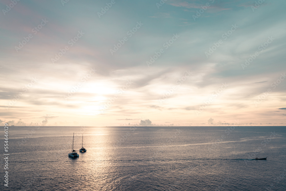 Golden sunset shine over the sea with sailboats Golden sunset shine over the sea with sailboats
