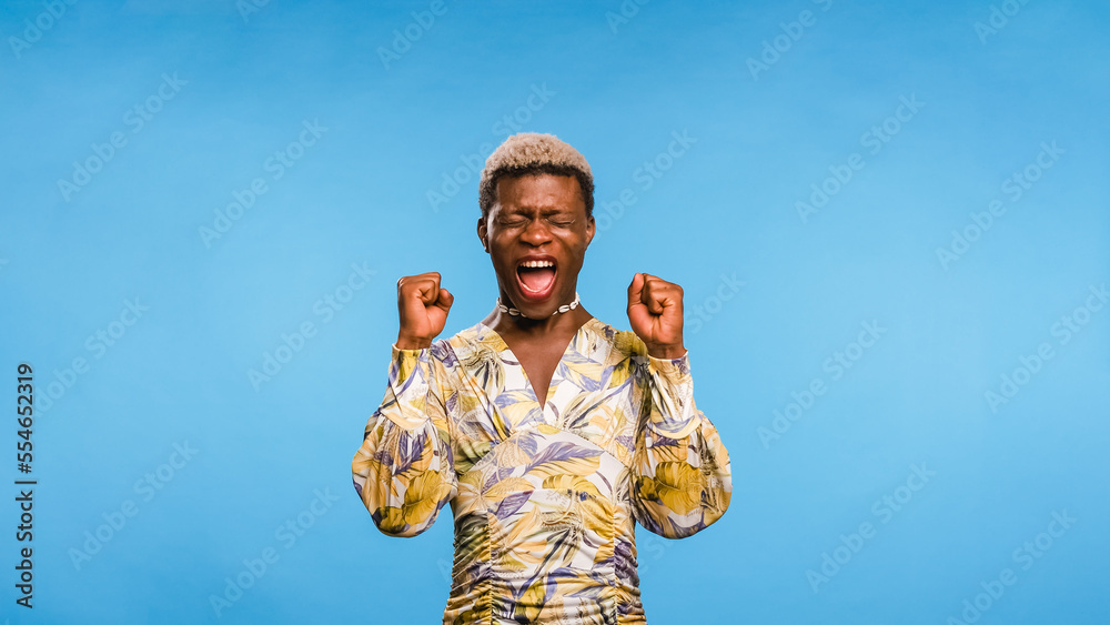 Black African model winner screaming on blue Black African model winner screaming on blue
