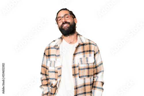 Young man with beard over isolated chroma key background laughing