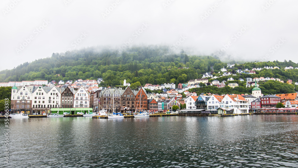 Bergen, Norway - June 07, 2022: The waterfront a the harbor of Bergen in Norway with the famous Bryggen houses as part of the UNESCO heritage