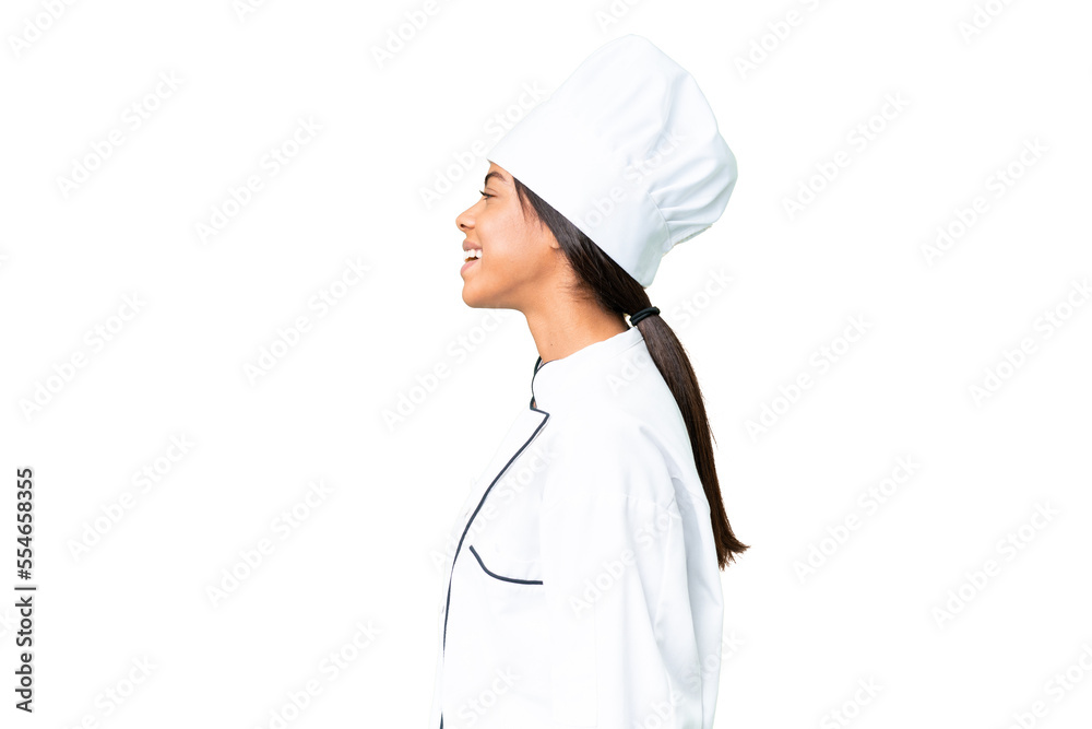 Young African American chef over isolated chroma key background laughing in lateral position Young African American chef over isolated chroma key background laughing in lateral position
