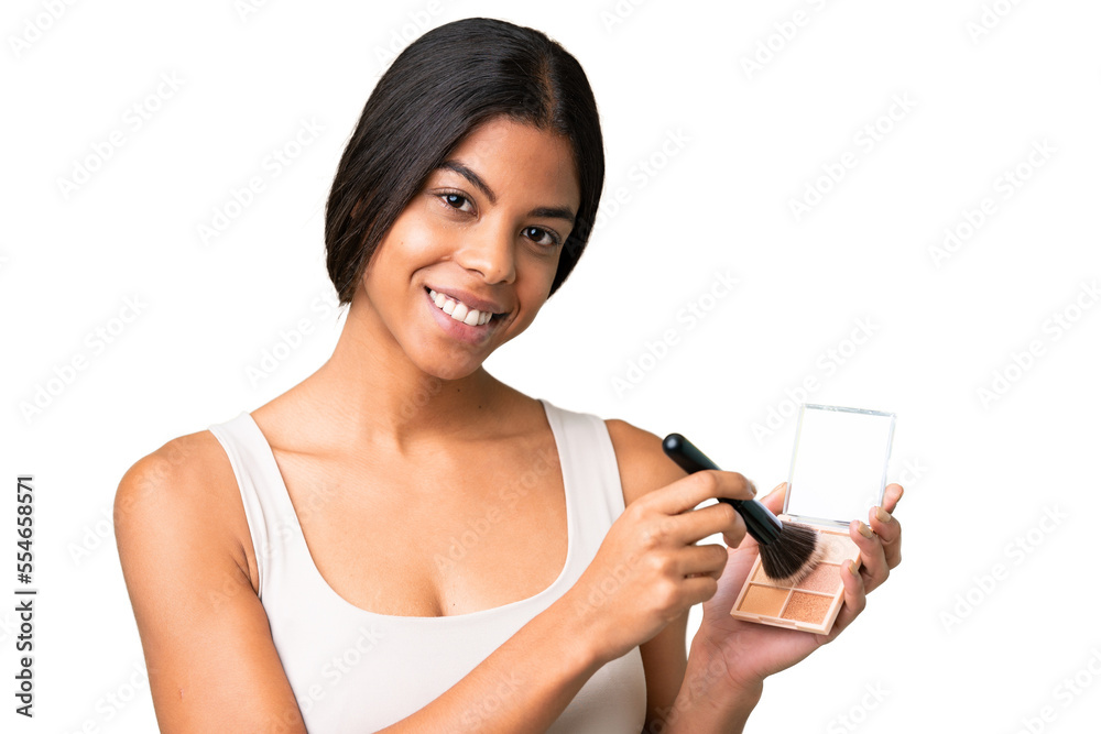 Young woman over over isolated chroma key background with makeup palette and happy Young woman over over isolated chroma key background with makeup palette and happy