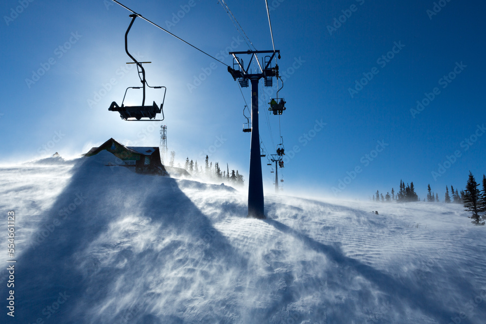 View from mount peak on Sheregesh ski resort and Altai mountains or Gornaya Shoria. Active winter rest, skiers and snowboarders on ski slope and Ski lift, beautiful nature and sport leisure. View from mount peak on Sheregesh ski resort and Altai mountains or Gornaya Shoria. Active winter rest, skiers and snowboarders on ski slope and Ski lift, beautiful nature and sport leisure.