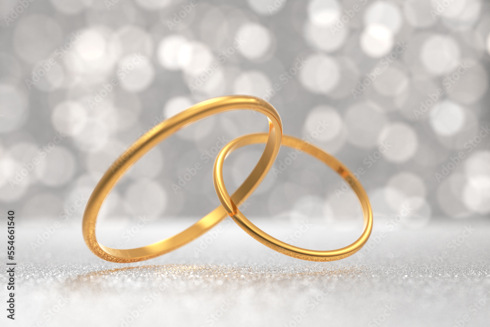 golden wedding rings for the wedding of the newlyweds on a light background with shiny bokeh. Rings threaded into each other. 3d render. golden wedding rings for the wedding of the newlyweds on a light background with shiny bokeh. Rings threaded into each other. 3d render.