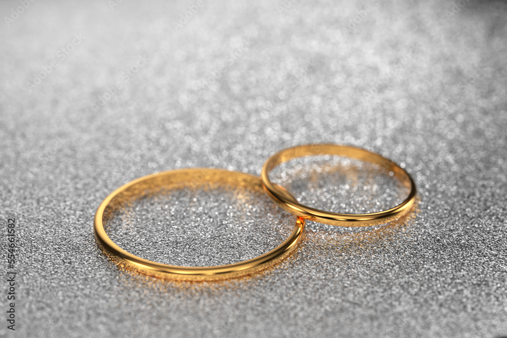 gold wedding rings for the wedding of the newlyweds lie on a light, shiny background. 3d render. gold wedding rings for the wedding of the newlyweds lie on a light, shiny background. 3d render.