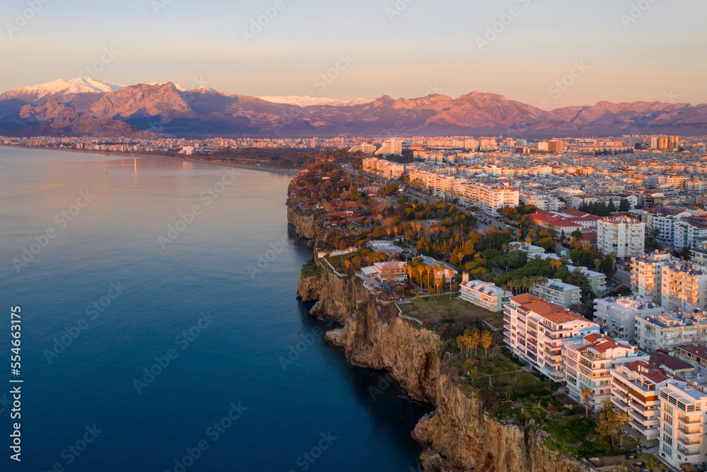Aerial view of Antalya and covered with snow mountains at sunrise, Turkey.